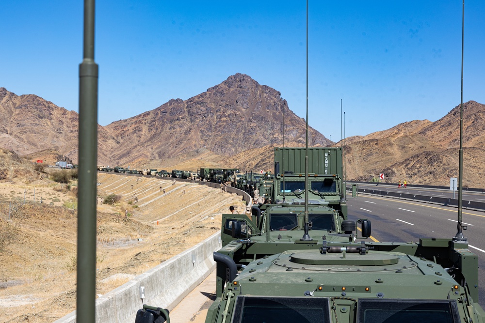 Military tactical vehicles with radio antennas in convoy
